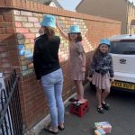 Chalking on the rainbow wall