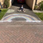 Chalked rainbow on driveway